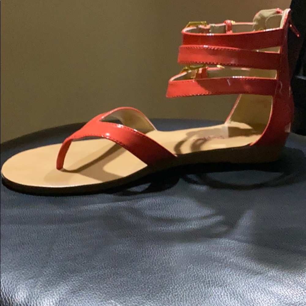 Orange sandals by pink and pepper.